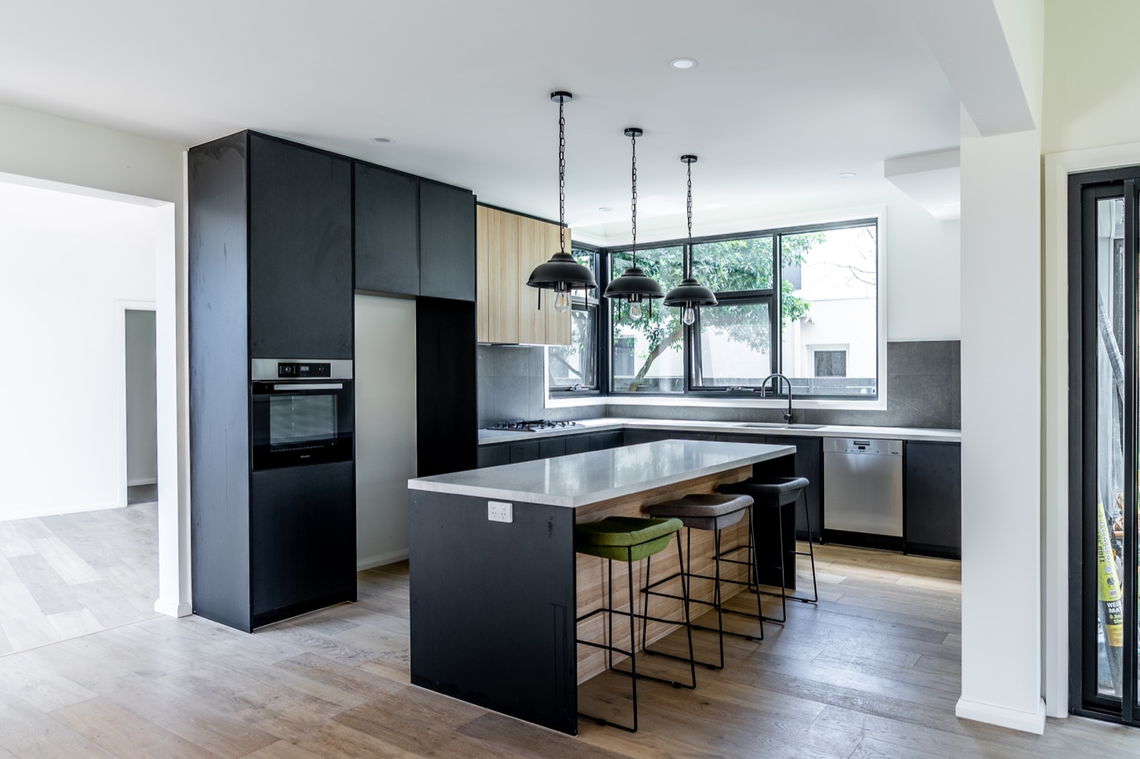 Completed HiCabinet kitchen with dark cabinetry and island