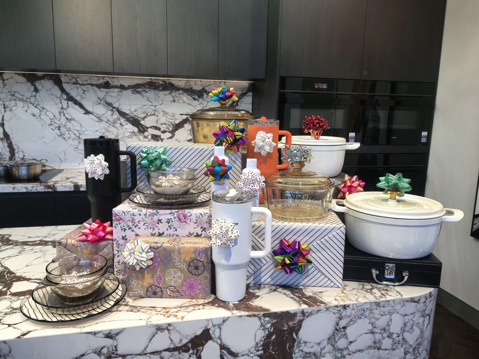 HiCabinet showroom display of cookware, drinkware and tableware prepared as welcome gifts